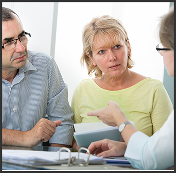 Couple Discussing Plans With Realtor